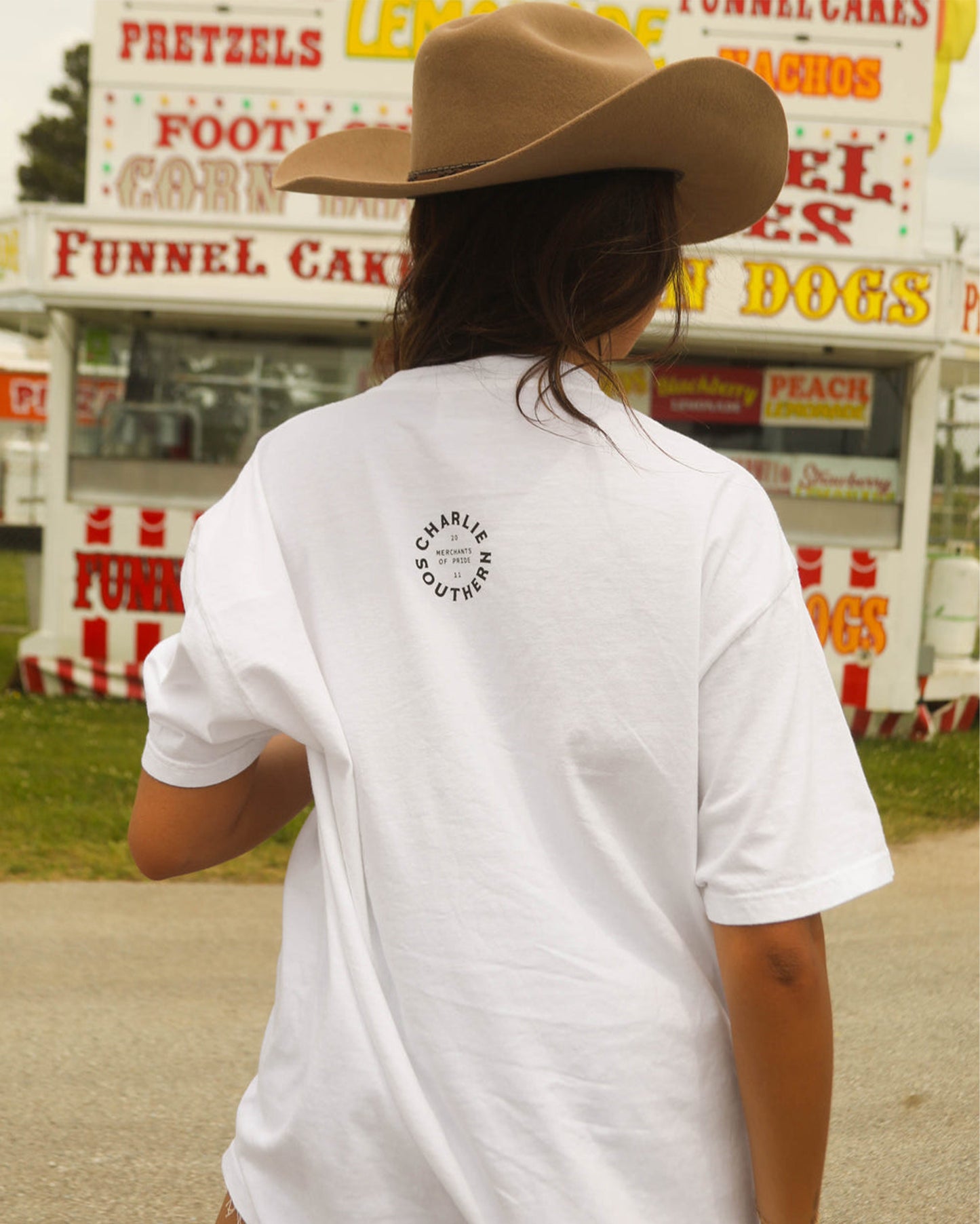 Back view of the Women's Hot Dogs And Cold Beer Tee by Charlie Southern, showcasing the brand logo on a casual white tee, great for summer fun.